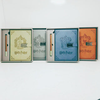 Four Harry Potter-themed notebooks with covers in different colors