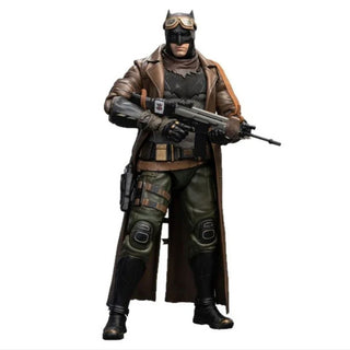 Batman Action figure in tactical outfit with rifle on a white background