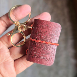 Gryffindor Hogwarts Diary keychain - in hand for size comparison