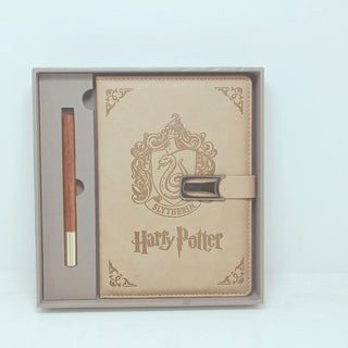 Harry Potter notebook and pen set with Slytherin emblem in packaging