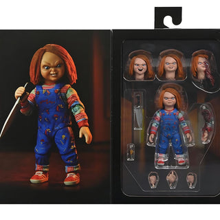Action figure of a character with red hair and blue overalls next to its packaging