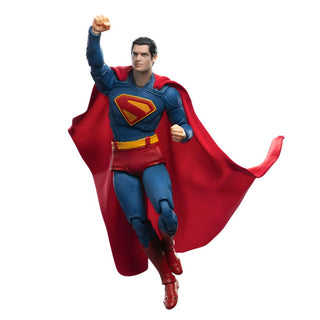 Superman action figure in a dynamic pose on a white background