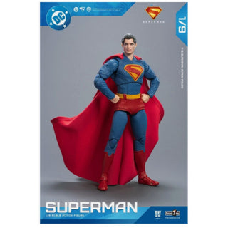 Superman action figure with red cape and blue suit on a gray background