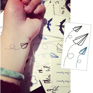 paper plane tattoo